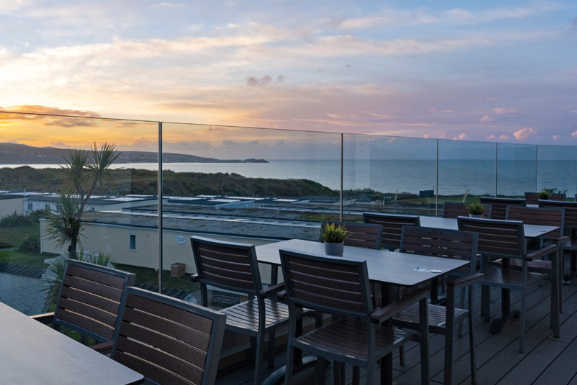 Restaurant with sea view of the Sunset over St Ives Bay Cornwall